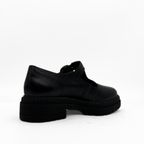 Zola black leather T-strap Mary Jane with a lug sole platform