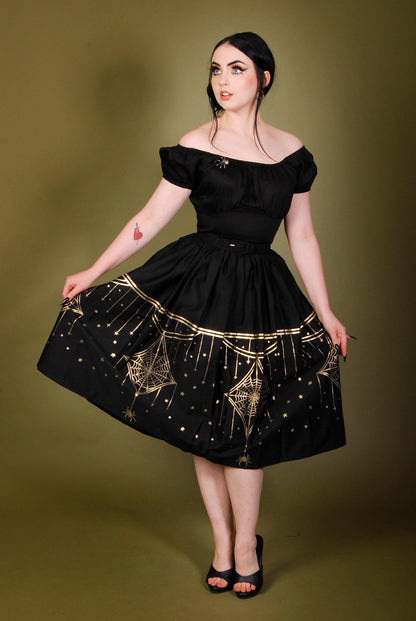 Bella Gathered Swing Skirt In Black & Gold Deco Spiderweb Border Print | Laura Byrnes & Hope Morrison - pinupgirlclothing.com