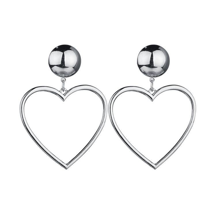 Pictured is a pair of heart-shaped hoop style earrings dangling from ball-shaped closures at each ear lobe in silver tone.