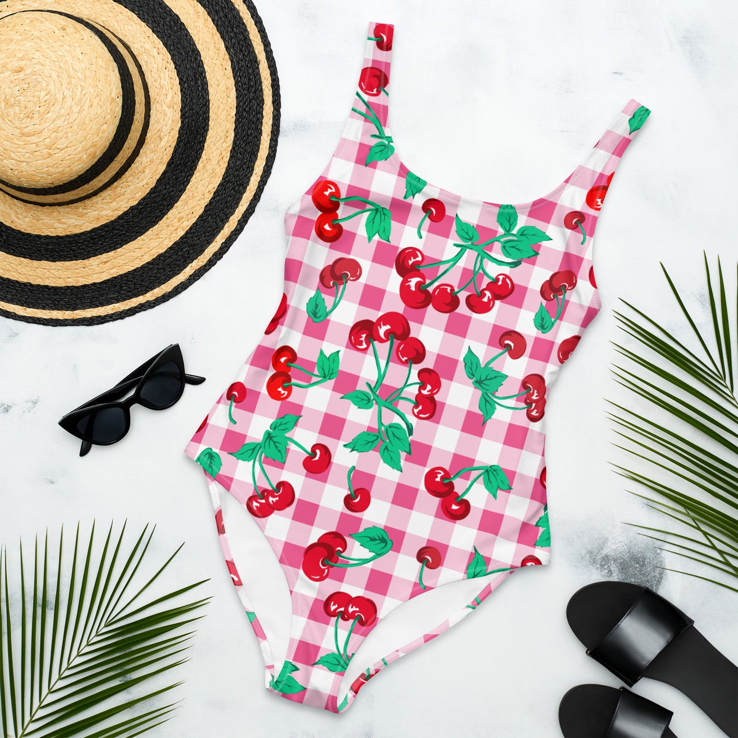 https://pinupgirlclothing.com/cdn/shop/products/all-over-print-one-piece-swimsuit-white-front-643df7aed8a77.jpg?v=1689039797&width=1445
